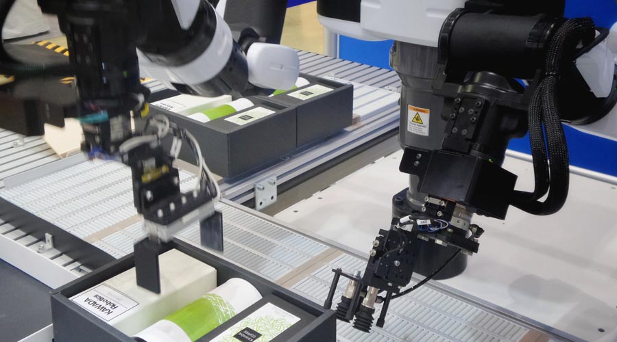articulated arms on an assembly line